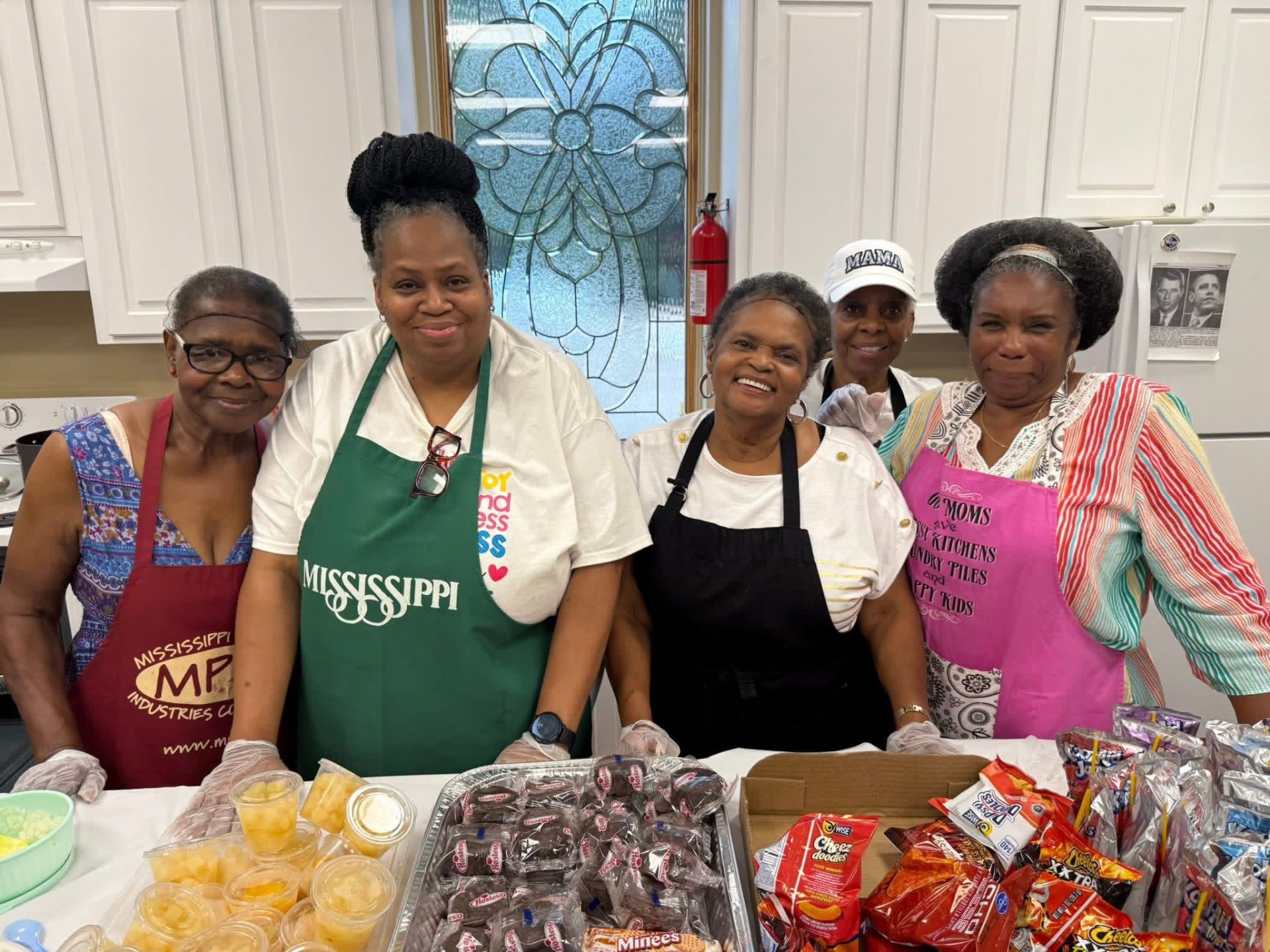 Greater Grove Street volunteers serving refreshments in the fellowship kitchen