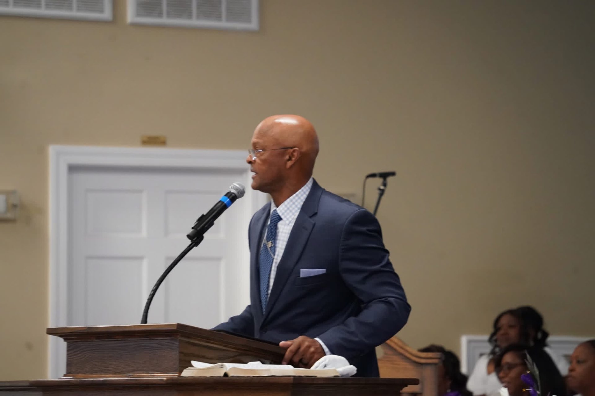Rev. Dr. Casey D. Fisher preaching from the pulpit