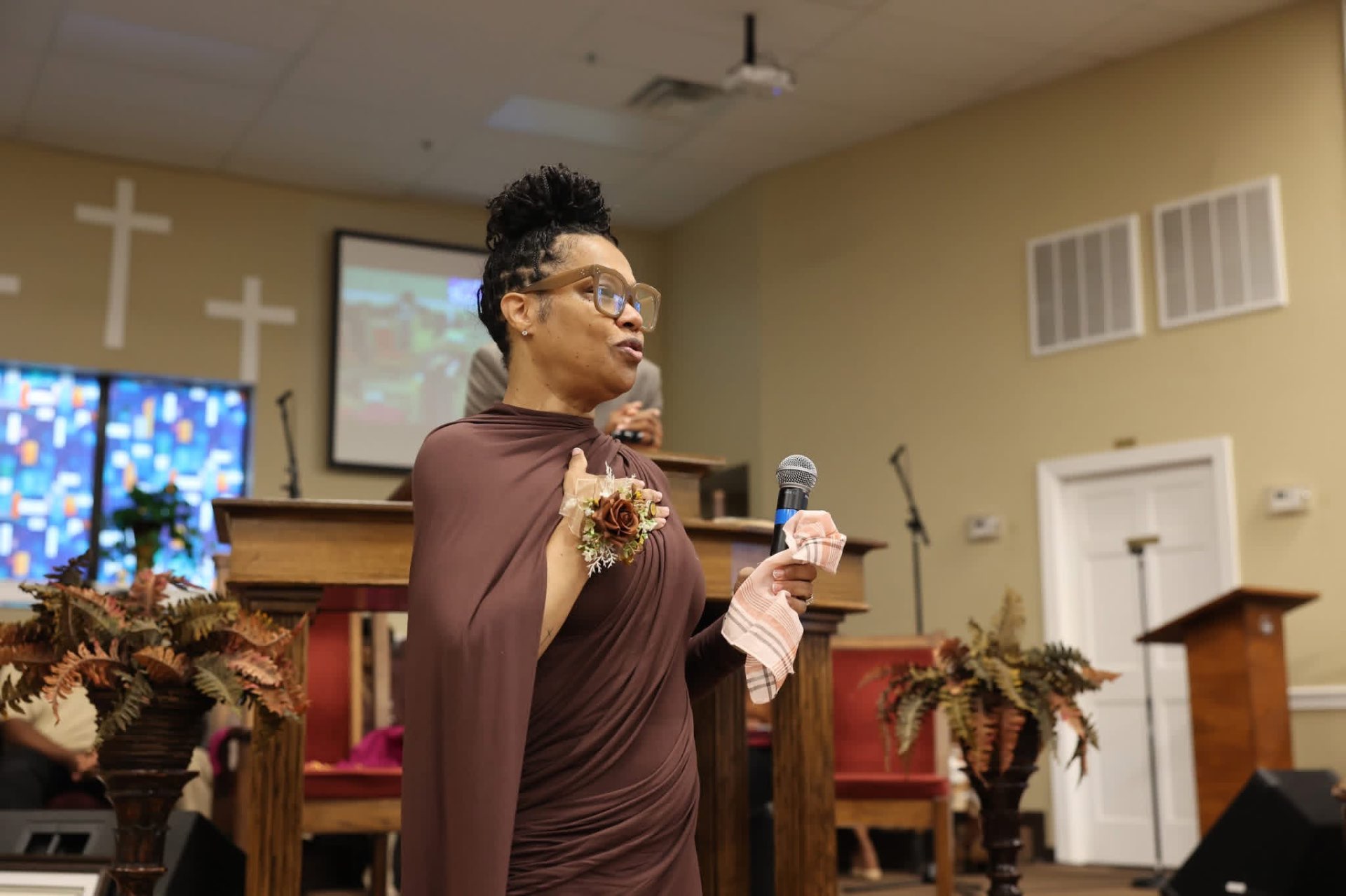 A woman speaking during a Greater Grove Street gathering